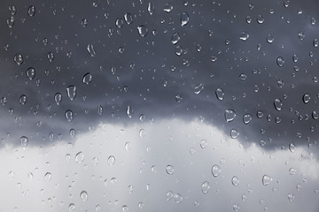 Rain drops on rain storm background.