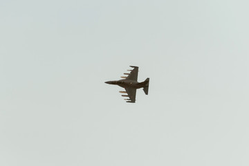 Yakovlev Yak-130 (Mitten) subsonic two-seat advanced jet trainer/light attack aircraft or lead-in fighter trainer flies against blue sky background
