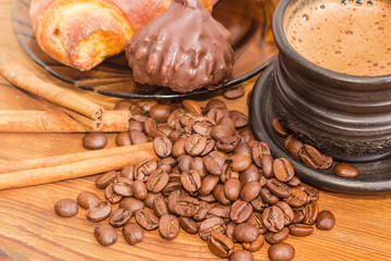 Fototapeta premium Coffee beans, brewed coffee, cinnamon sticks, chocolate truffle