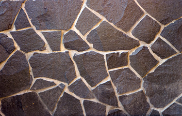 orange wall of a wild stone close-up