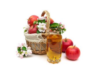 ripe apples and glass of juice on a white background