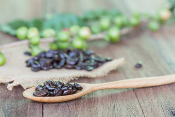 Fresh coffee beans on wood