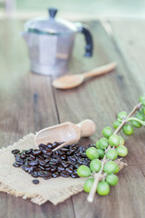 Fresh coffee beans on wood
