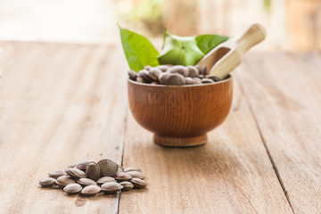 dried capsule seeds fruit of Sacha Inchi peanut on wooden