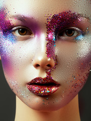 Beauty, cosmetics and makeup. Magic eyes look with bright creative make-up. Macro shot of beautiful...