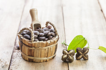 dried capsule seeds fruit of Sacha Inchi peanut in basket