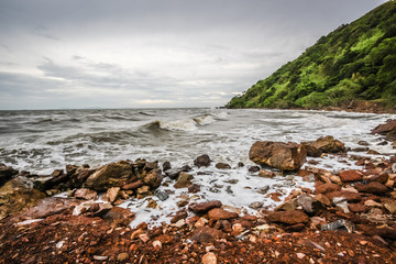 Beautiful rock beach moutain and sea