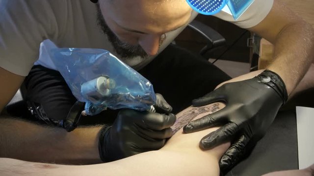 Getting a tattoo. Close-up, toned image