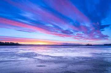 Ice covered lake with dramatic sky