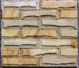 Wall of Indian sandstone, with a beautiful structure, decorative building, facing material