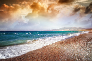 Obraz premium Tilt shift, beautiful colorful sunset on the sea shore.