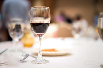 Glass of red wine on the table.