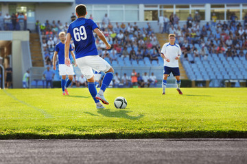 Football match in sunny summer day