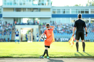 Football match in sunny summer day
