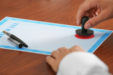 Notary public in office stamping document