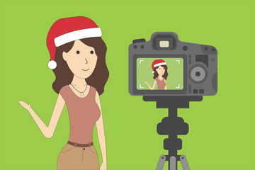 Christmas blog recording on chroma key background. Vlog. Video recording. Beautiful girl in santa hat.
