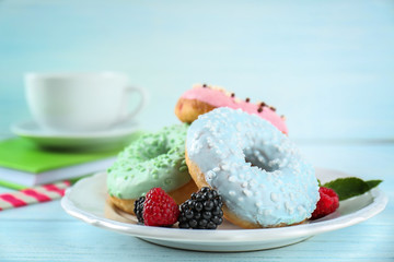 Plate with delicious donut and berries, closeup