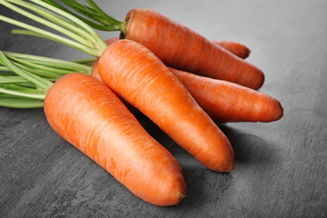 Fresh carrots on color background