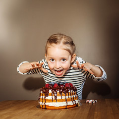 girl at birthday with cake. Studio shot