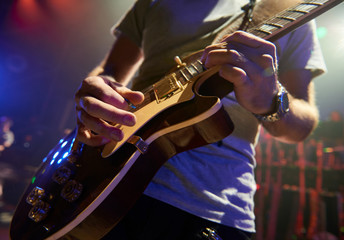 Naklejka premium The guitarist plays solo.