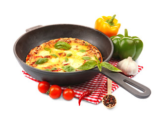 Freshly baked pizza in a pan on white background