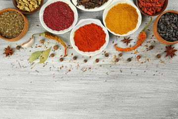 Aromatic spices on wooden background
