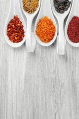 Aromatic spices on wooden background
