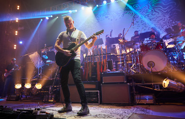 The guitarist plays solo.