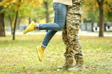 Soldier reunited with wife on a sunny day