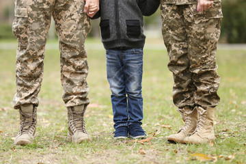 Military family reunited on a sunny day,  closeup