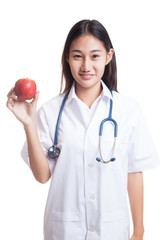 Young Asian female doctor show an apple.