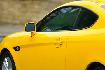 Obraz na płótnie Canvas Modern yellow car, outdoor