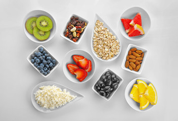 Healthy eating concept. Assortment of products in bowls on white background