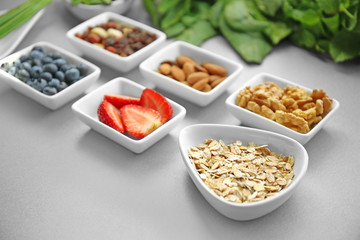 Healthy eating concept. Assortment of products in bowls on table, closeup
