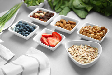 Healthy eating concept. Assortment of products in bowls on table, closeup