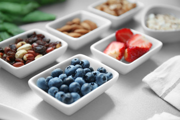 Healthy eating concept. Assortment of products in bowls on table, closeup