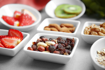 Healthy eating concept. Assortment of products in bowls on table, closeup