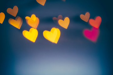 Abstract background. Bokeh hearts shape. Shiny hearts light bokeh Valentine's day background