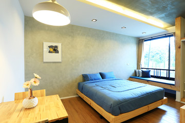 Interior design of room with furniture. Comfortable with bed, sofa, chairs, standing lamp, small table