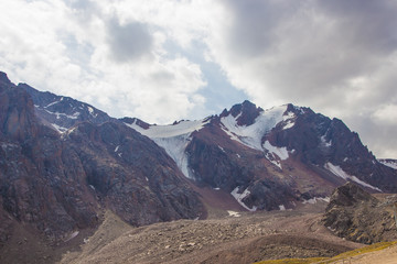 Snow-covered peaks behind Talgar Pass in Tien Shan mountains, Al