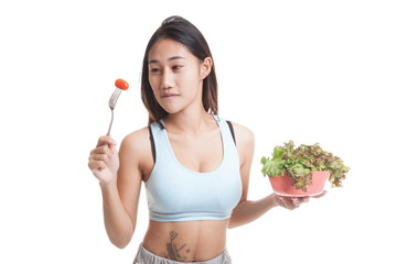 Beautiful Asian healthy girl enjoy eating  salad.