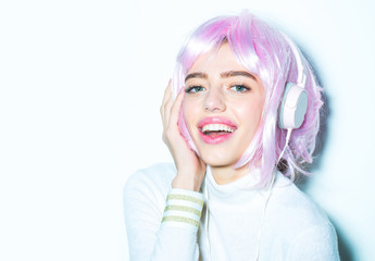 girl in pink wig with headset
