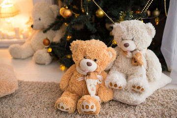 Bears on the background of Christmas tree