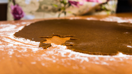Making Gingerbread Cookies Series. Cutting dough sheet into shap
