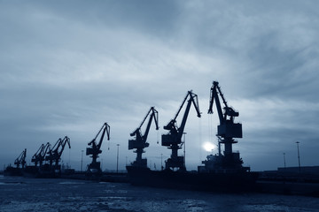 Port gantry crane at work, in the cargo terminal
