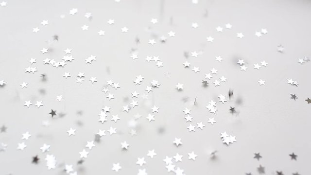 Christmas siver shiny stars konfetti are falling