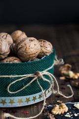 Walnuts in Festive Tin on Rustic Wooden Table