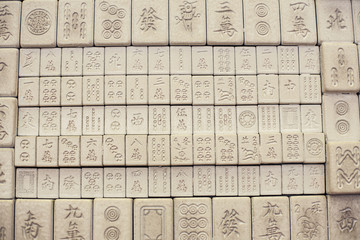 Wall of chinese characters on bricks