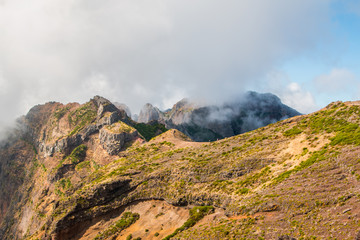 Obraz na płótnie Canvas Hiker admiring Pico do Arierio, Ruivo, Madeira, Portugal, Europe