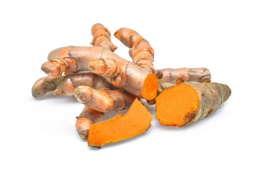 fresh turmeric roots isolated on white background